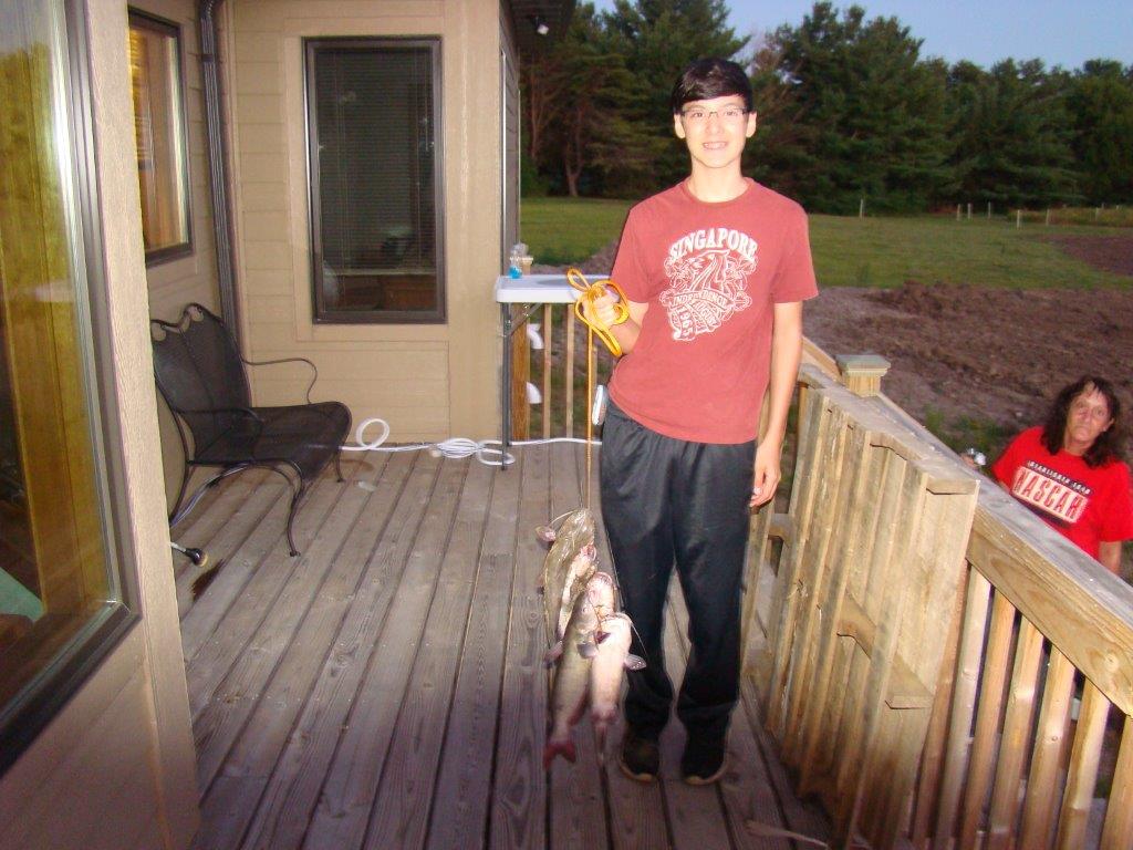Attached picture Daniel with first CC harvest.jpg